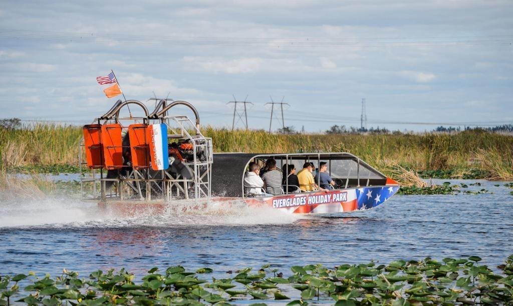 Air boat Carrying Tourists Through Everglades Waterways